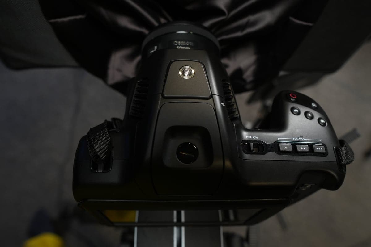 A Blackmagic cinema camera with a Canon lens, seen from above