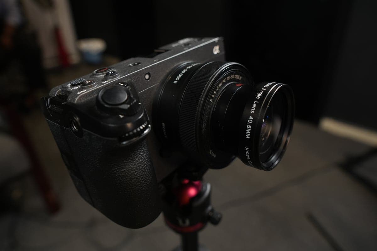 A cinema camera fitted with a cine lens, on its tripod